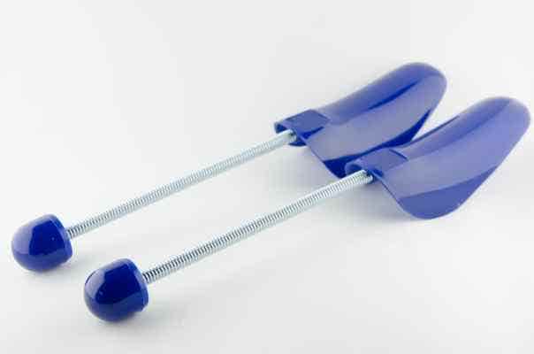 Two modern-looking blue shoe trees on a plain background.